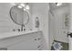 Well-lit bathroom features a modern sink, stylish mirror, and sleek fixtures at 425 Birkdale Dr, Fayetteville, GA 30215