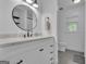 Bright bathroom featuring a modern vanity with marble countertop, stylish mirror, and sleek fixtures at 425 Birkdale Dr, Fayetteville, GA 30215