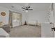 Cozy Bedroom with a gray chair, white crib, and board and batten accent wall at 425 Birkdale Dr, Fayetteville, GA 30215