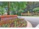 Welcoming Whitewater Creek community entrance with beautiful landscaping and brick signage at 425 Birkdale Dr, Fayetteville, GA 30215