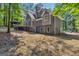 Exterior angle showcases a two-story home with backyard gazebo and wooded surroundings at 425 Birkdale Dr, Fayetteville, GA 30215