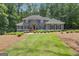 Stately two-story home with manicured lawn and mature trees at 425 Birkdale Dr, Fayetteville, GA 30215