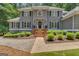 Inviting front entrance with brick stairs and manicured bushes at 425 Birkdale Dr, Fayetteville, GA 30215