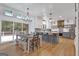 Open-concept kitchen and dining area featuring a large island, stainless steel appliances, and sliding glass doors to outdoor space at 425 Birkdale Dr, Fayetteville, GA 30215