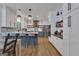 Modern kitchen featuring gray and white cabinetry, stainless steel appliances, a quartz countertop, and open shelving at 425 Birkdale Dr, Fayetteville, GA 30215