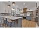 Bright kitchen with white cabinets, quartz countertops, and stainless steel appliances at 425 Birkdale Dr, Fayetteville, GA 30215