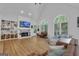 Spacious living room with fireplace, vaulted ceiling and large windows at 425 Birkdale Dr, Fayetteville, GA 30215