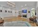 Bright living room with fireplace, built-in shelving, and an open layout with hardwood flooring; perfect for gatherings at 425 Birkdale Dr, Fayetteville, GA 30215