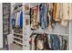 Spacious walk-in closet featuring custom shelving, rods, and ample storage for clothes, shoes, and accessories at 425 Birkdale Dr, Fayetteville, GA 30215
