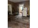 A dining room area featuring vintage wallpaper, hardwood floors, and a refrigerator against the wall at 301 Wedowee St, Bowdon, GA 30108