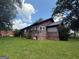 The exterior view of the house shows the expansive yard and back of the house at 301 Wedowee St, Bowdon, GA 30108