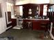 A kitchen with red brick accents, cabinets, and a dishwasher at 301 Wedowee St, Bowdon, GA 30108