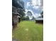 The side yard shows ample space and other buildings on property at 301 Wedowee St, Bowdon, GA 30108