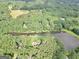 Aerial view of a property highlighting acreage and proximity to the lake at 123 Eva Ln, Stockbridge, GA 30281