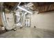 Unfinished basement featuring utility equipment and exposed ceiling at 123 Eva Ln, Stockbridge, GA 30281