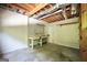Unfinished basement with a workbench, pegboard and concrete flooring ready for any project at 123 Eva Ln, Stockbridge, GA 30281