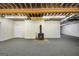Unfinished basement area with a fireplace and exposed ceiling at 123 Eva Ln, Stockbridge, GA 30281
