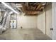 Unfinished basement with concrete flooring, exposed ductwork, and plenty of room for storage at 123 Eva Ln, Stockbridge, GA 30281