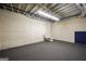 Finished basement with carpet, utility sink, toilet, and block walls with ample room for customization at 123 Eva Ln, Stockbridge, GA 30281