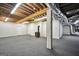 Large basement area with a wood burning stove and exposed HVAC at 123 Eva Ln, Stockbridge, GA 30281