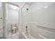 Bright bathroom features a tub and shower combination at 123 Eva Ln, Stockbridge, GA 30281