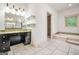 Bathroom boasts double vanity, tile flooring, and a built-in vanity at 123 Eva Ln, Stockbridge, GA 30281