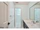 Light-filled bathroom featuring a marble vanity and decorative mirror at 123 Eva Ln, Stockbridge, GA 30281