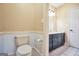 Comfortable bathroom featuring a toilet and vanity with a black cabinet at 123 Eva Ln, Stockbridge, GA 30281
