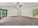 Spacious bedroom with carpet flooring, large windows, and access to an outdoor balcony at 123 Eva Ln, Stockbridge, GA 30281