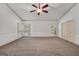 A bright, carpeted bedroom with a vaulted ceiling and shuttered windows for natural light at 123 Eva Ln, Stockbridge, GA 30281