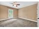 Spacious bedroom features a ceiling fan and a window with shutter-style blinds at 123 Eva Ln, Stockbridge, GA 30281