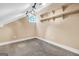 Bonus room with vaulted ceiling, custom shelving and a unique window at 123 Eva Ln, Stockbridge, GA 30281