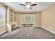 Bonus room showcases a bay window, built-in shelves, a desk, and neutral carpeting at 123 Eva Ln, Stockbridge, GA 30281