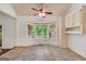 Charming breakfast nook with bay window, ceiling fan, and lots of natural light, adjacent to kitchen at 123 Eva Ln, Stockbridge, GA 30281