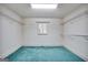 Walk-in closet providing ample shelving, blue carpeting and natural light at 123 Eva Ln, Stockbridge, GA 30281