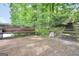 Wooden dock with wooden bench, steps, and a peaceful water view at 123 Eva Ln, Stockbridge, GA 30281