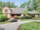 Charming home with stone accents, red shutters, and a beautifully landscaped yard at 123 Eva Ln, Stockbridge, GA 30281