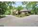 Exterior view of a home with driveway and stone garage at 123 Eva Ln, Stockbridge, GA 30281