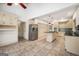 Open-concept kitchen adjacent to breakfast room featuring stainless steel appliances and ample storage at 123 Eva Ln, Stockbridge, GA 30281
