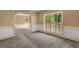 Inviting living room featuring neutral tones, an archway, and a window with shutters at 123 Eva Ln, Stockbridge, GA 30281