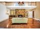 Cozy living room featuring a stone fireplace, hardwood floors, vaulted ceiling, and access to an upper level at 123 Eva Ln, Stockbridge, GA 30281