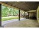 A large outdoor patio boasts a stone wall, stairs and lush backyard at 123 Eva Ln, Stockbridge, GA 30281
