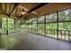 Spacious screened porch with ceiling fan offering views of natural scenery at 123 Eva Ln, Stockbridge, GA 30281