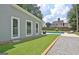 Backyard features a sparkling pool, lush greenery, and ample space for outdoor lounging at 345 Summer Pl, Peachtree City, GA 30269