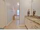 Bright bathroom with dual sink vanity and a peek into the luxurious bathtub area at 345 Summer Pl, Peachtree City, GA 30269