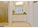 Bright bathroom featuring granite counters, large mirror and walk-in shower at 345 Summer Pl, Peachtree City, GA 30269