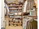 Walk-in closet featuring an abundance of shelves and hanging racks for storage at 345 Summer Pl, Peachtree City, GA 30269