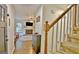 Inviting entryway showcases a staircase with carpet runner and a view into the living room at 345 Summer Pl, Peachtree City, GA 30269