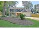 Charming two-story home featuring a well-manicured lawn, inviting curb appeal, and an attached two-car garage at 345 Summer Pl, Peachtree City, GA 30269
