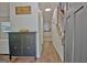 Welcoming hallway with wood floors, staircase, and a glimpse into the kitchen area offering a warm invitation at 345 Summer Pl, Peachtree City, GA 30269